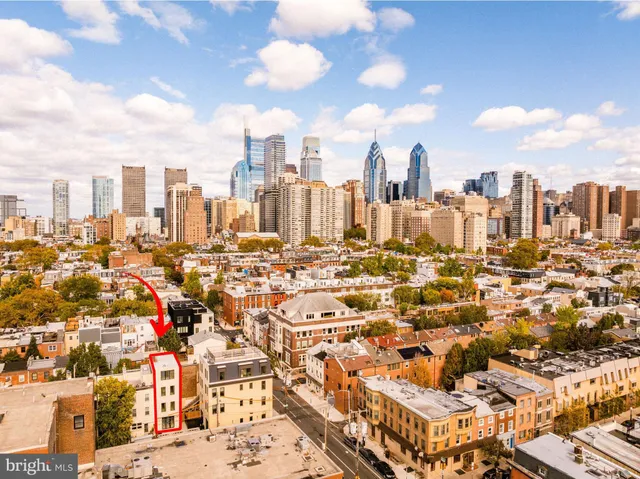 a view of city with tall buildings