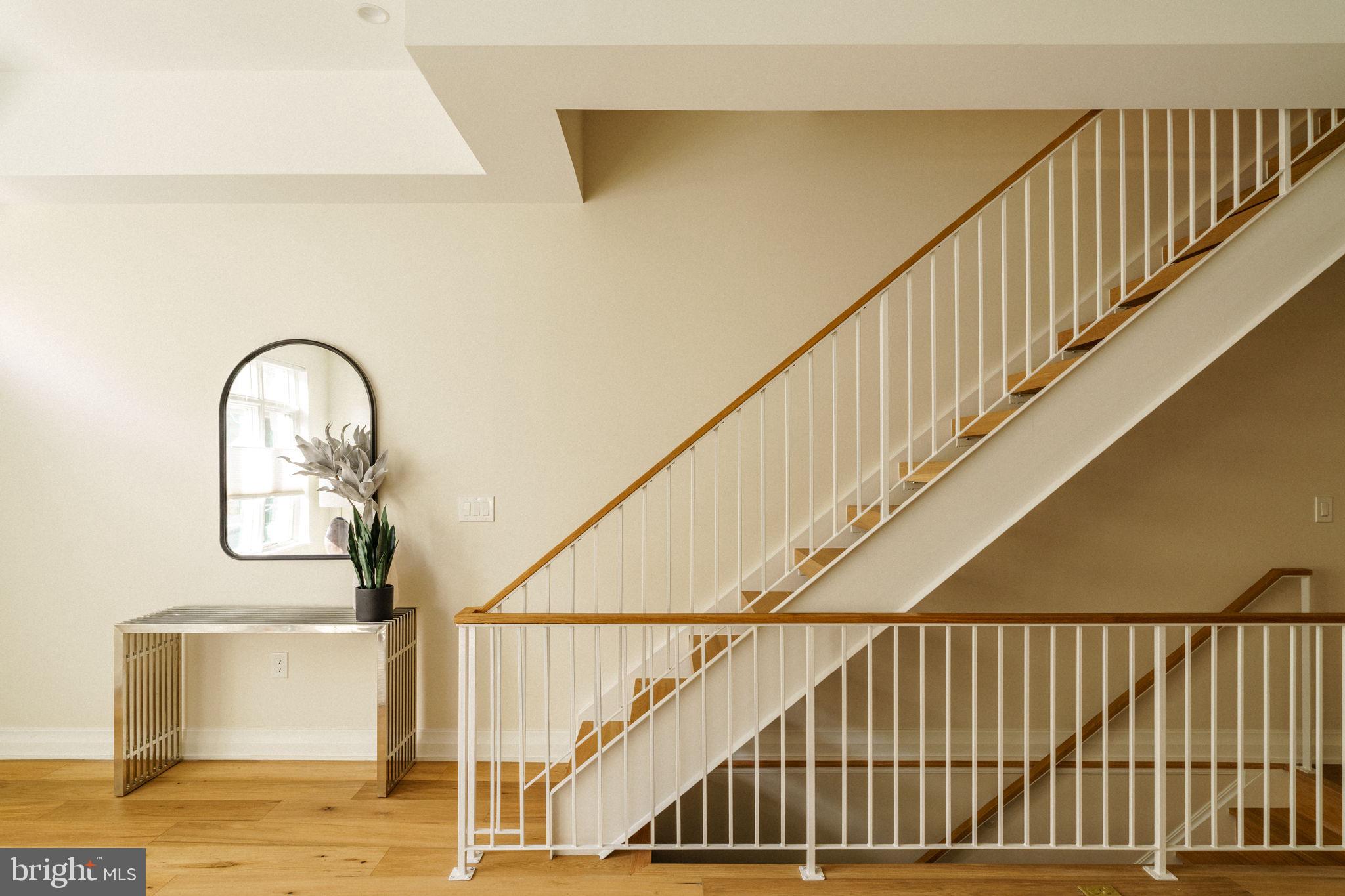 2104 Naudain Street Philadelphia, PA 19146 - Photo 5 of 56 a view of staircase with railing and a potted plant