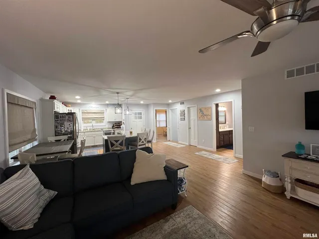 a bed room with a bed and a large window