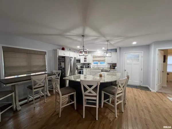 a bedroom with a large bed and a large window