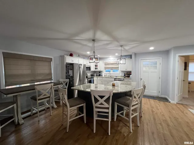 a bedroom with a large bed and a large window