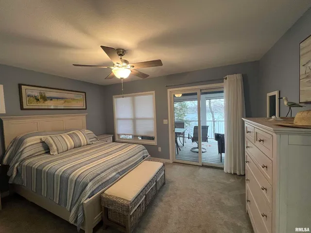a bedroom with a bed and a book shelf