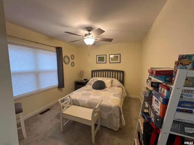 a living room with furniture and a gym
