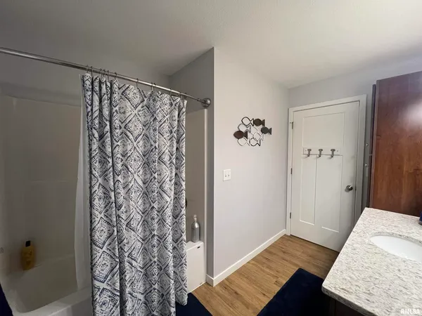 a bedroom with a bed and a desk