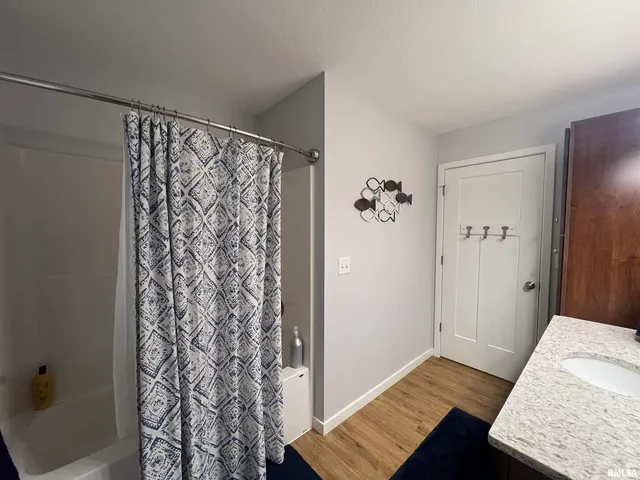 a bedroom with a bed and a desk