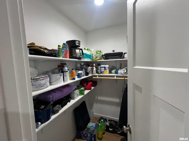 a bedroom with a bed and a desk