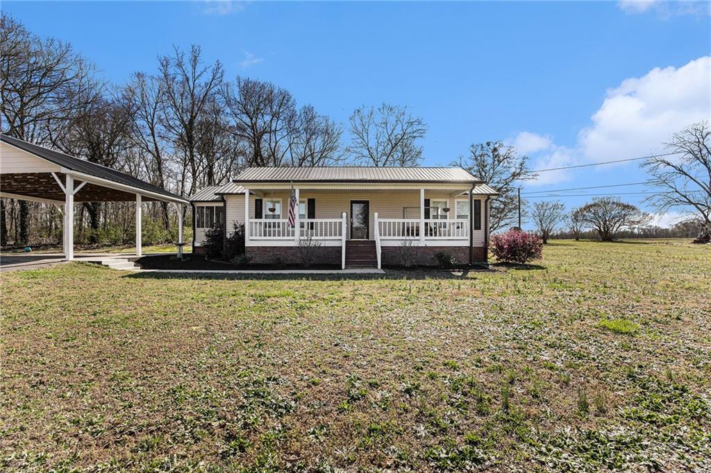2859 Sandy Cross Road Royston, GA 30662 - Photo 1 of 1 a view of a house with a garden