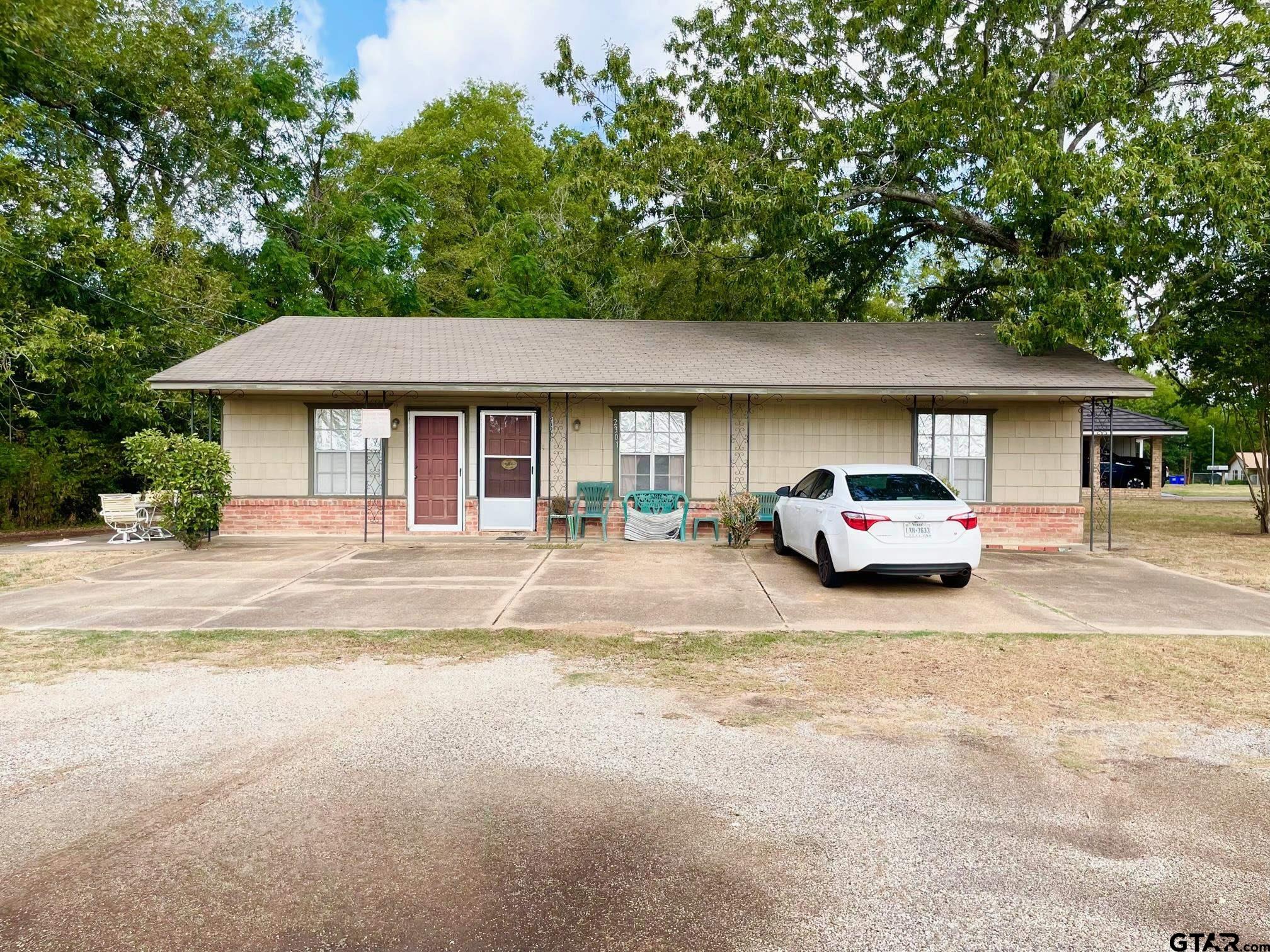 2301 North 6th Street Crockett, TX 75835 - Photo 3 of 12 a car parked in front of house