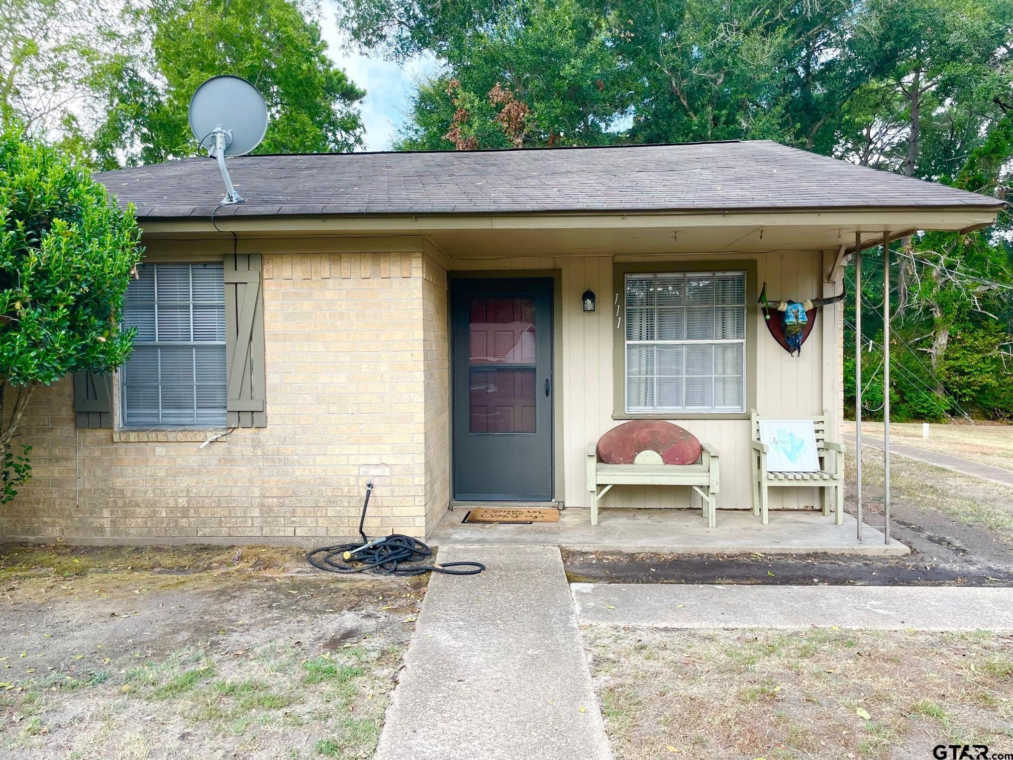 2301 North 6th Street Crockett, TX 75835 - Photo 7 of 12 a front view of a house with garden