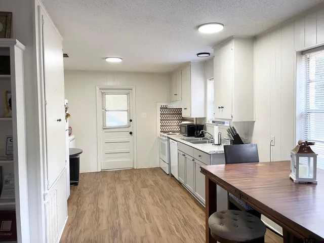 a kitchen with sink cabinets and window