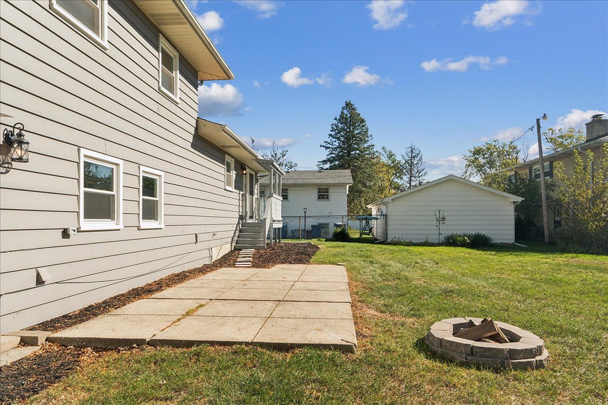 364 Division Street Crete, IL 60417 - Photo 44 of 47 a view of a backyard with plants and barbeque grill
