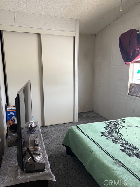 2500 North State Highway 59, Unit 270 Merced, CA 95340 - Photo 8 of 14 a bedroom with a bed and a mirror