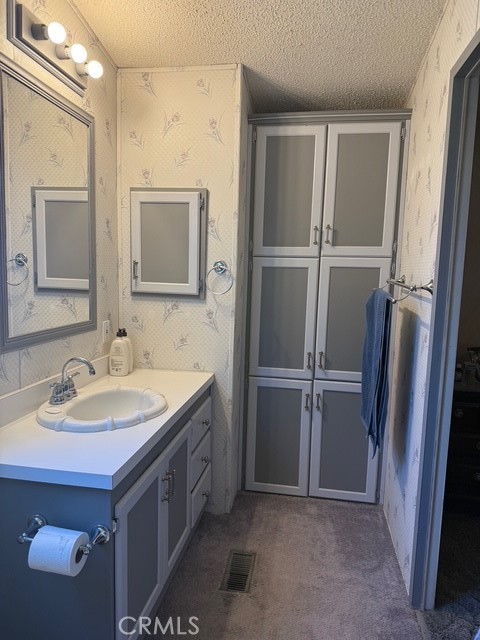 2500 North State Highway 59, Unit 270 Merced, CA 95340 - Photo 10 of 14 a bathroom with a sink and a mirror