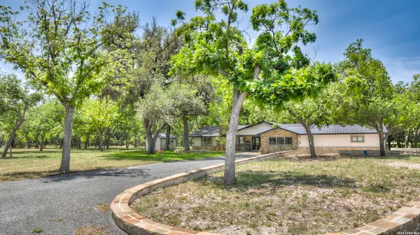 a view of a lake with deck and yard