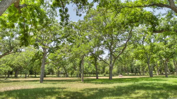 a view of a dining room with furniture and a window