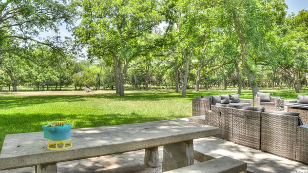 a bedroom with a bed and a night stand