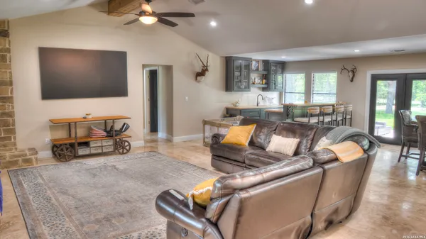 a bathroom with a glass shower door
