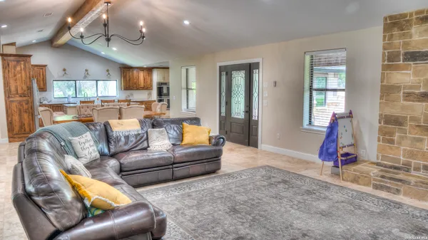 a bathroom with a window and a shower