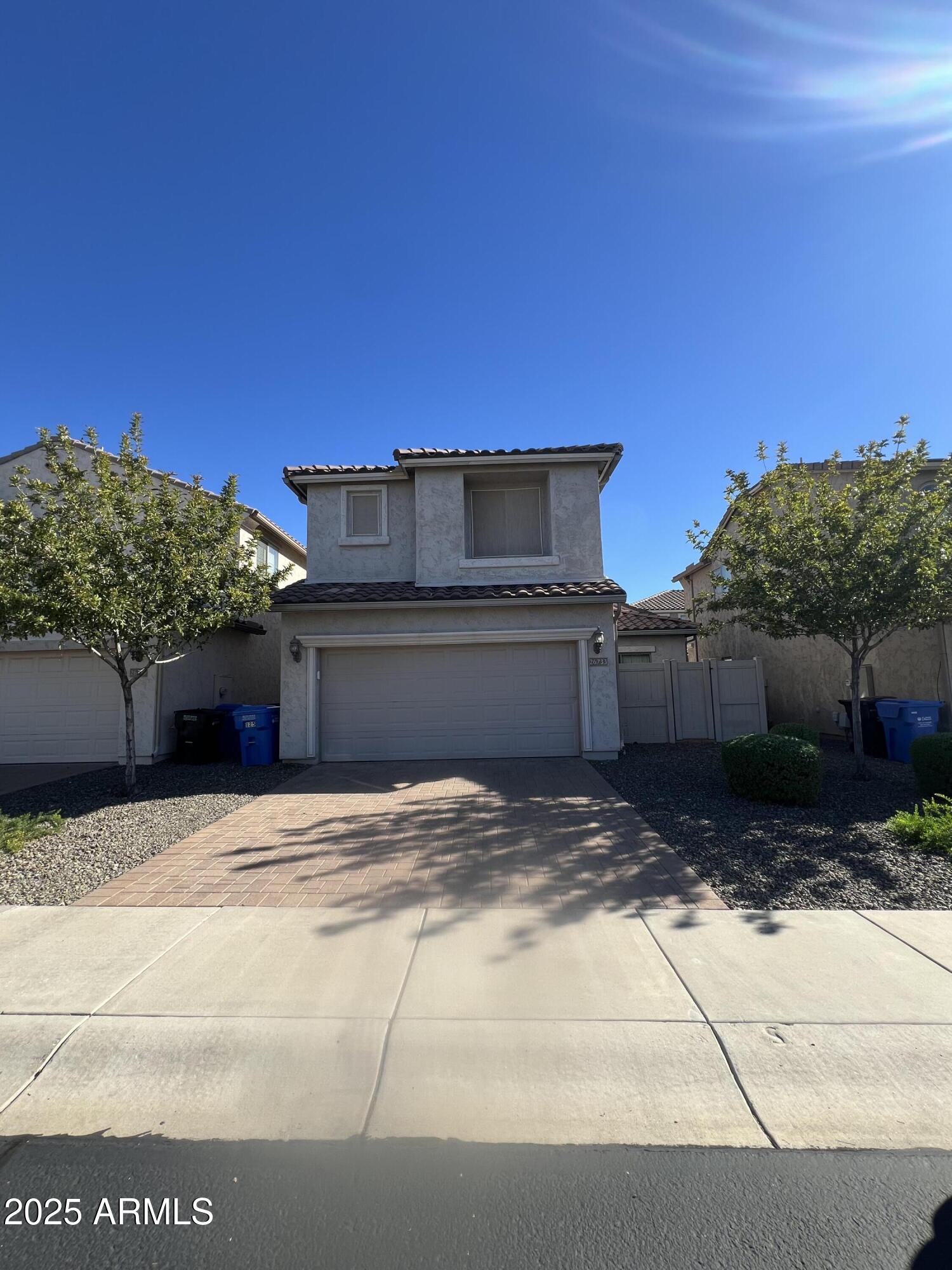 a view of garage with a wooden fence