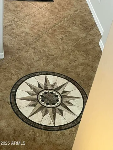 a bathroom with a sink a large mirror and a shower