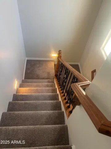 a white toilet sitting next to a bath tub