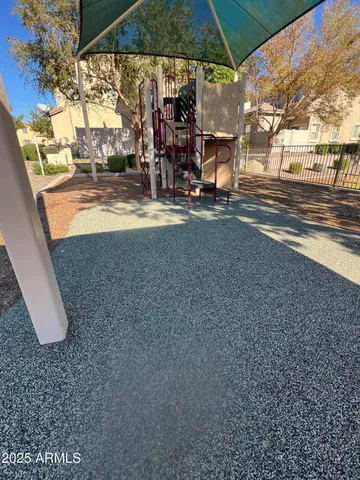 a view of a patio with swimming pool table and chairs