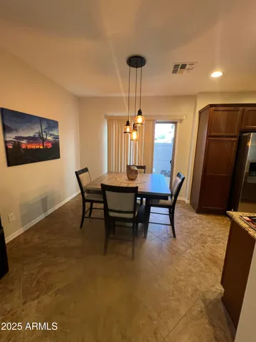 a view of a dining room with furniture