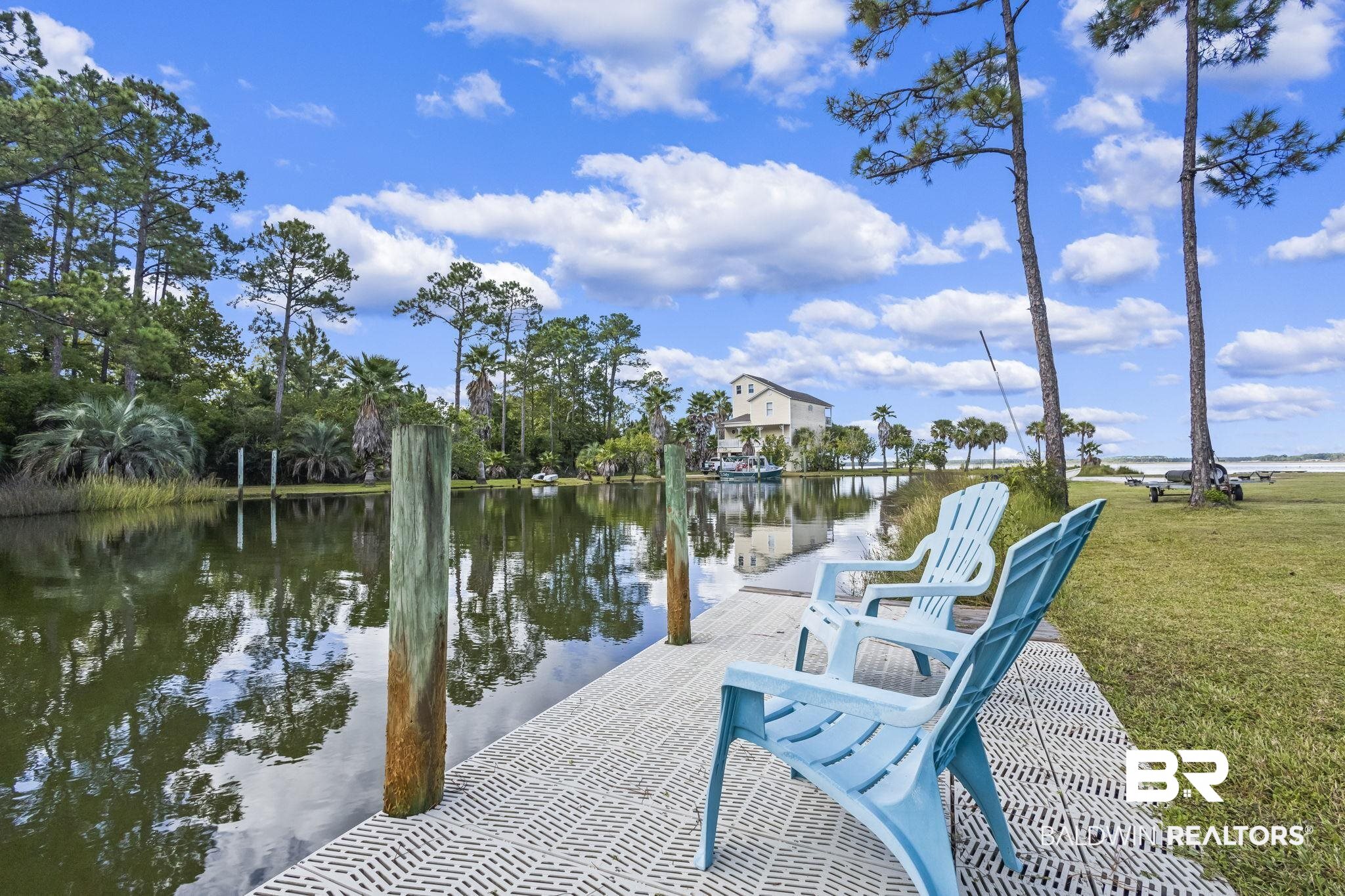 7849 Bayshore Drive Elberta, AL 36530 - Photo 2 of 47 View of dock with a yard and a water view