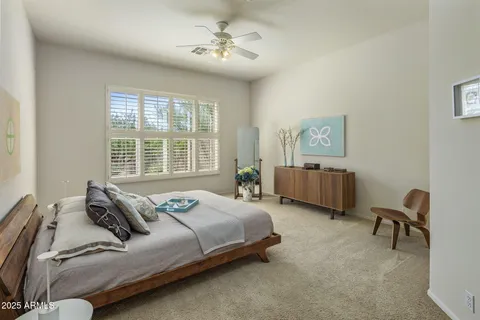 a bedroom with bed and a window