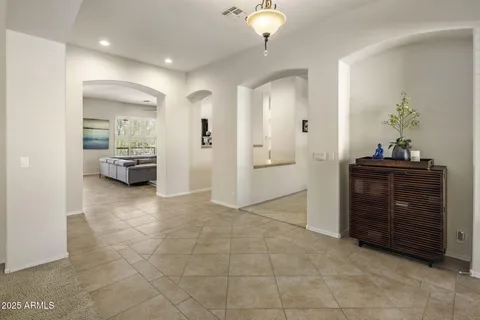 a view of empty room with kitchen