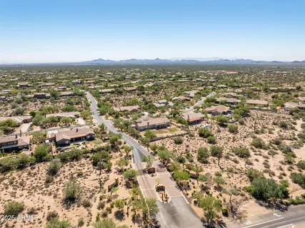 an aerial view of residential building with parking space