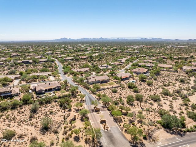 an aerial view of residential building with parking space