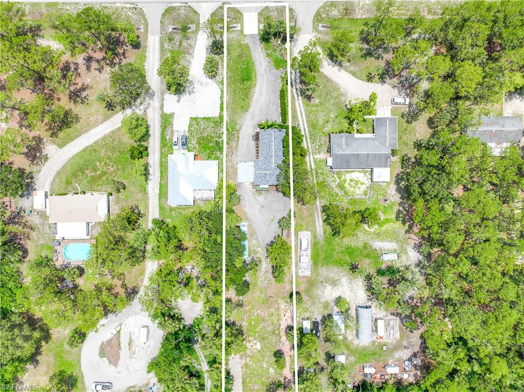 4641 Pine Ridge Road Naples, FL 34119 - Photo 26 of 30 a view of a garden