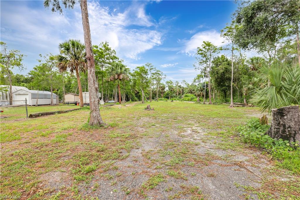 4641 Pine Ridge Road Naples, FL 34119 - Photo 30 of 30 a view of a playground with a tree