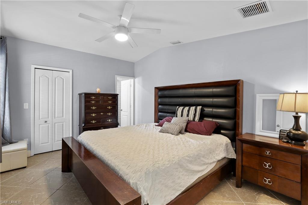 4641 Pine Ridge Road Naples, FL 34119 - Photo 6 of 30 a bedroom with a bed and a closet