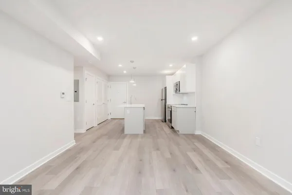 a view of a kitchen with wooden floor