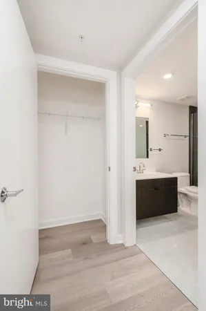 a bathroom with a tub shower and a sink