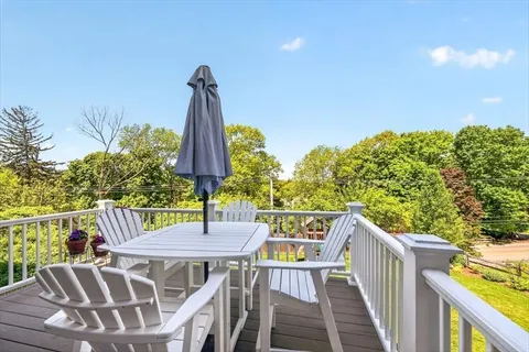 a view of a chairs and table in the balcony