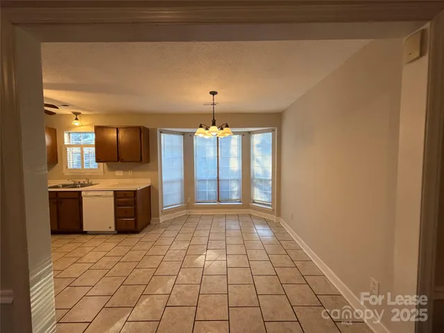 a view of a kitchen with a sink and a stove top oven