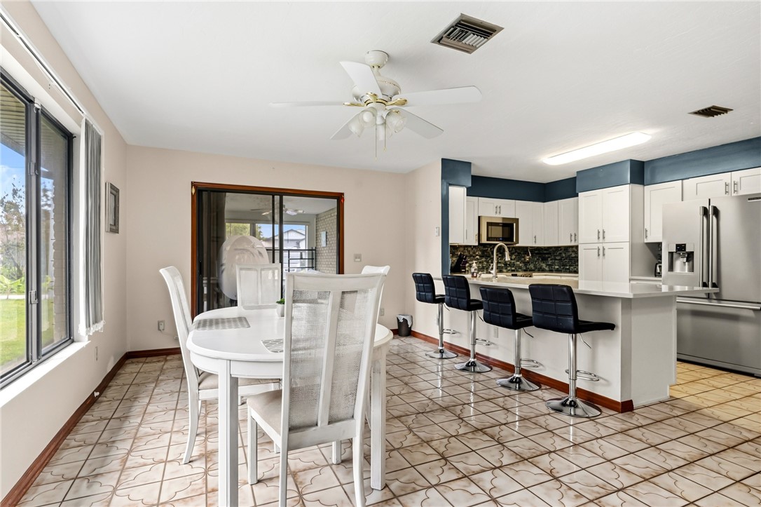 831 Clearmont Street Sebastian, FL 32958 - Photo 15 of 24 a view of a dining room with furniture