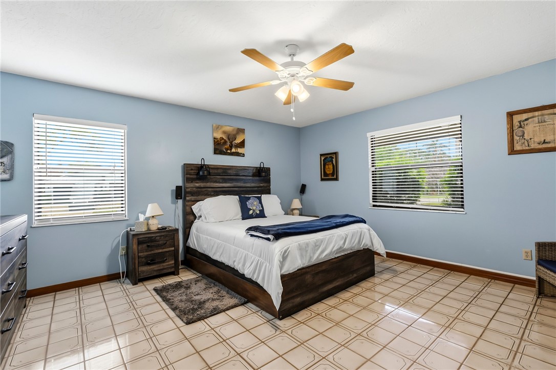 831 Clearmont Street Sebastian, FL 32958 - Photo 17 of 24 a bedroom with a bed and window