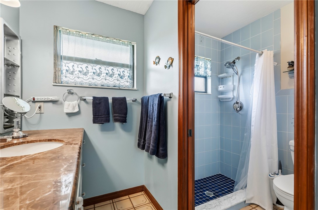 831 Clearmont Street Sebastian, FL 32958 - Photo 19 of 24 a bathroom with a sink a toilet and shower