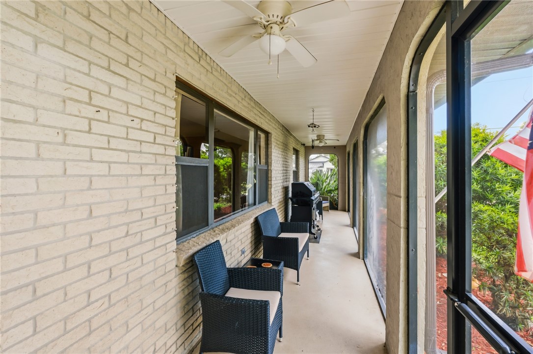 831 Clearmont Street Sebastian, FL 32958 - Photo 2 of 24 a building outdoor space with patio furniture