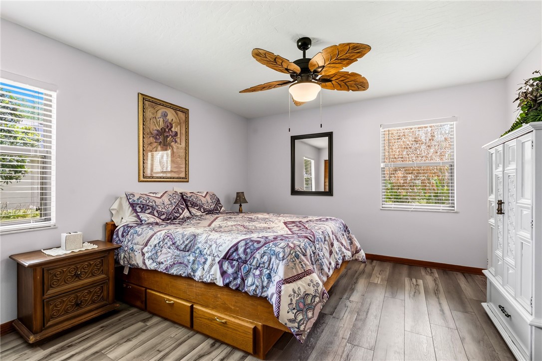 831 Clearmont Street Sebastian, FL 32958 - Photo 21 of 24 a bedroom with a bed and a chandelier