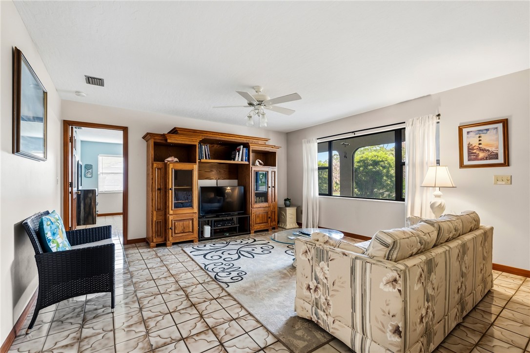 831 Clearmont Street Sebastian, FL 32958 - Photo 8 of 24 a bedroom with furniture and a window