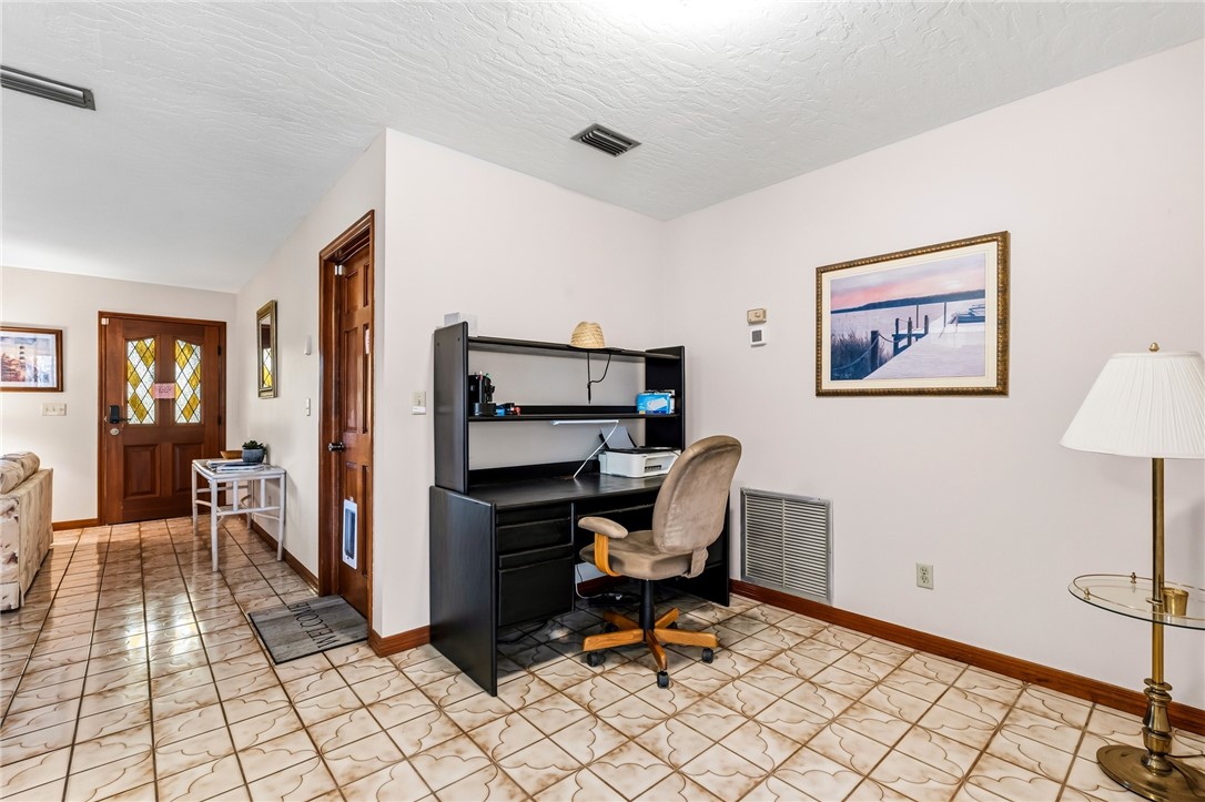 831 Clearmont Street Sebastian, FL 32958 - Photo 10 of 24 a view of a workspace with furniture and a window