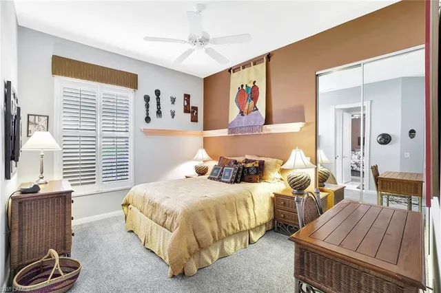 a bedroom with two beds and a window