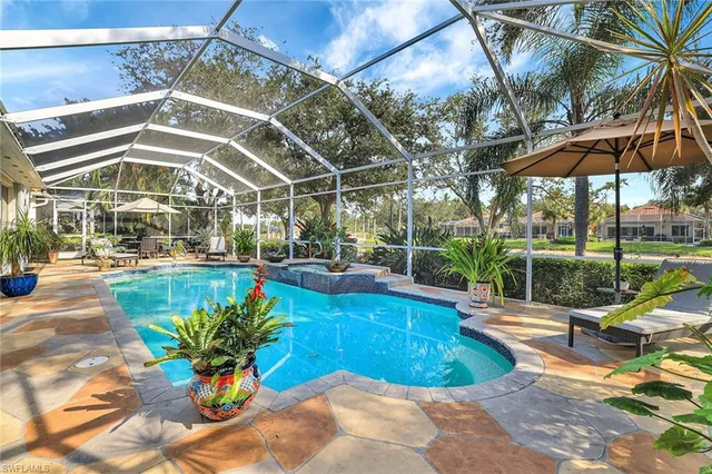 a view of a swimming pool with a patio
