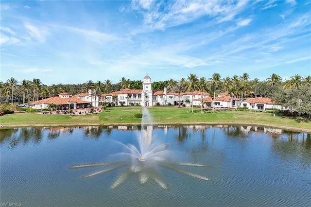 a view of a lake with houses in the back