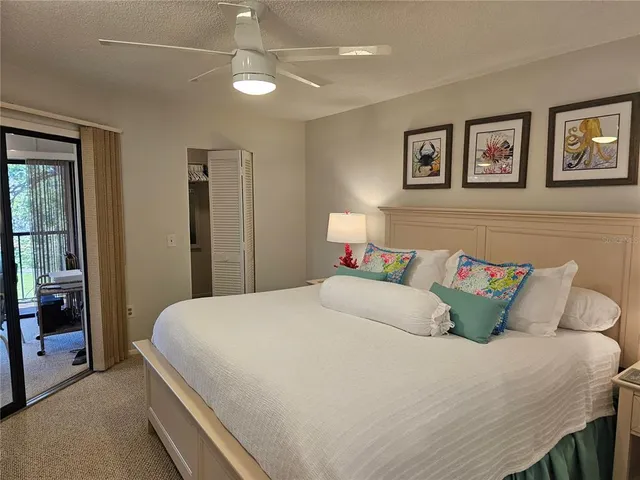 a bedroom with a bed and a lamp on table